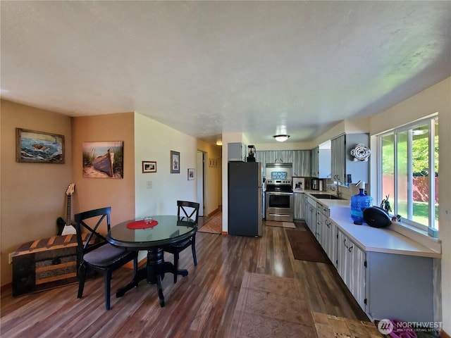 248 Ensign Ave NW, Ocean Shores, WA 98569 - dining area with dark wood-style flooring