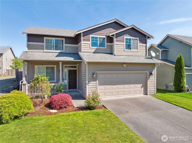 9831 198th St E, Graham, WA 98338 - view of front facade featuring covered porch, a garage, concrete driveway, a front yard, and roof with shingles