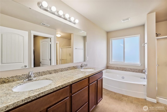 9831 198th St E, Graham, WA 98338 - full bath featuring a shower stall, a bath, and double vanity