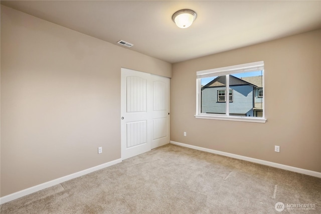 9831 198th St E, Graham, WA 98338 - unfurnished bedroom featuring carpet floors, baseboards, and a closet