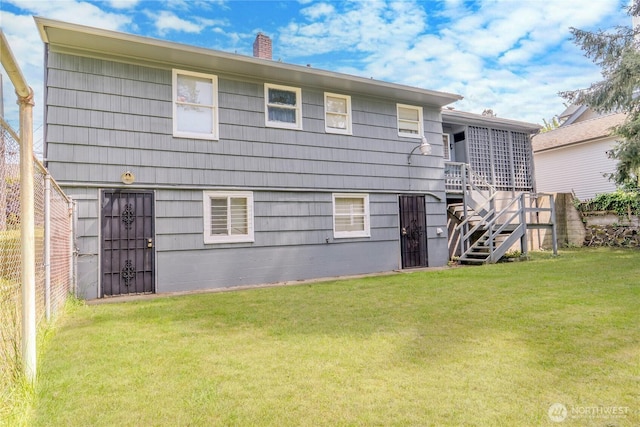 9829 60th Ave S, Seattle, WA 98118 - back of house with a chimney, stairs, and a deck