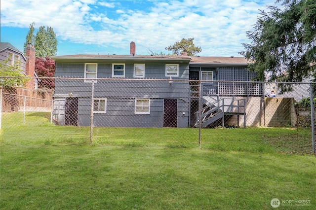 9829 60th Ave S, Seattle, WA 98118 - back of property with a chimney, a wooden deck, and stairs