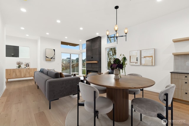 8337 14th Ave NW Unit A, Seattle, WA 98117 - dining area featuring light wood-type flooring, baseboards, recessed lighting, and a chandelier
