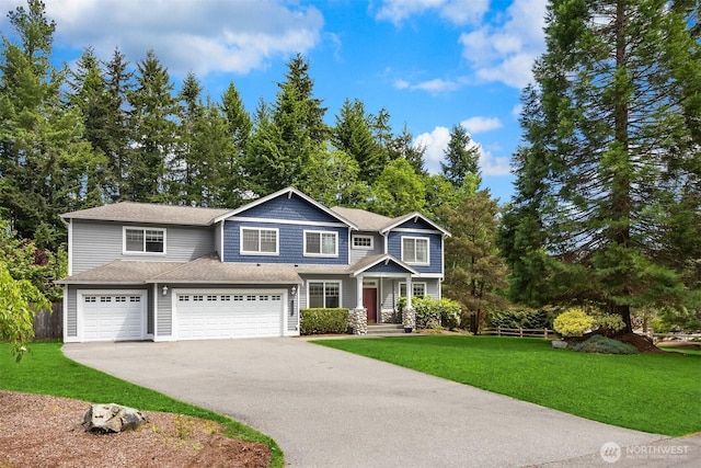 23600 Dunbar Pl NW, Poulsbo, WA 98370 - view of front of home featuring asphalt driveway, an attached garage, a front lawn, and a shingled roof