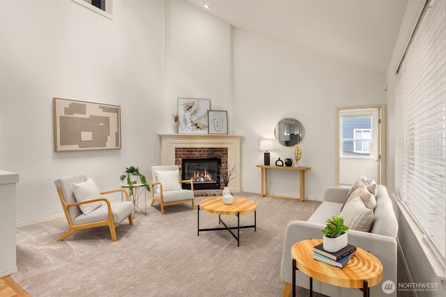 23600 Dunbar Pl NW, Poulsbo, WA 98370 - living room featuring a fireplace, high vaulted ceiling, and carpet