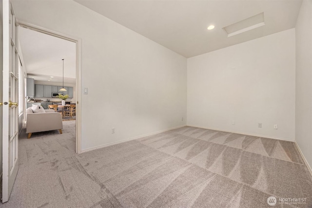 23600 Dunbar Pl NW, Poulsbo, WA 98370 - spare room with light carpet, attic access, and recessed lighting