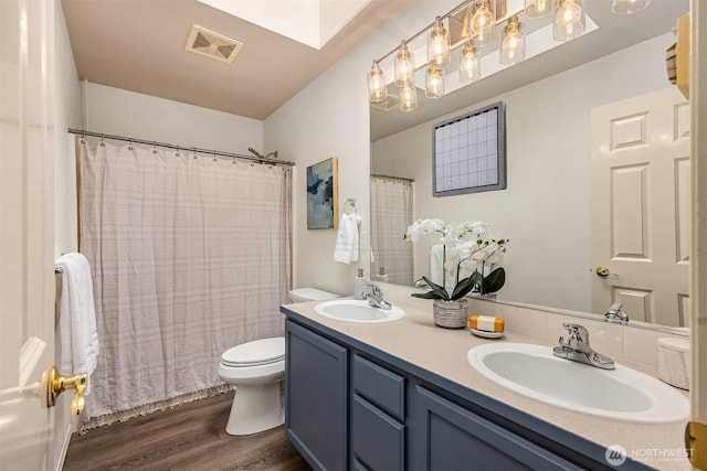 23600 Dunbar Pl NW, Poulsbo, WA 98370 - full bathroom with wood finished floors and double vanity