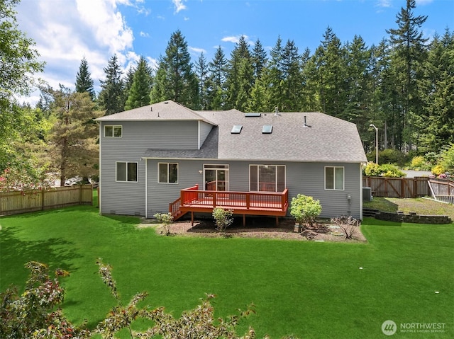 23600 Dunbar Pl NW, Poulsbo, WA 98370 - rear view of property featuring a wooden deck, a fenced backyard, and a shingled roof