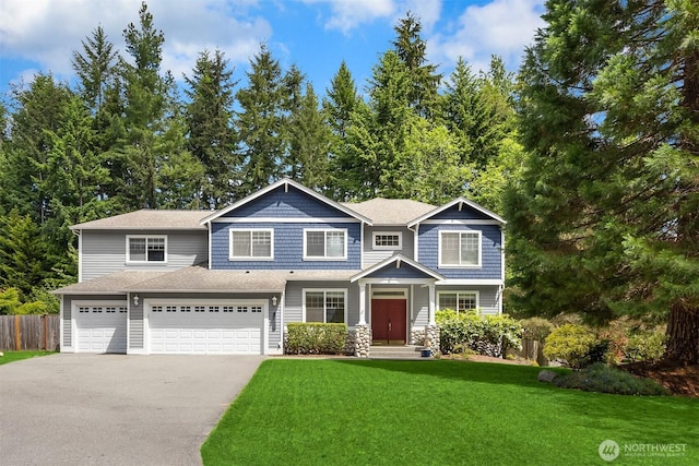 23600 Dunbar Pl NW, Poulsbo, WA 98370 - craftsman-style house featuring driveway, an attached garage, and roof with shingles