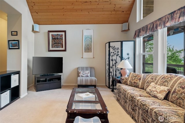 14647 NW Honeyhill Loop, Seabeck, WA 98380 - living area with light colored carpet, lofted ceiling, wood ceiling, and baseboards