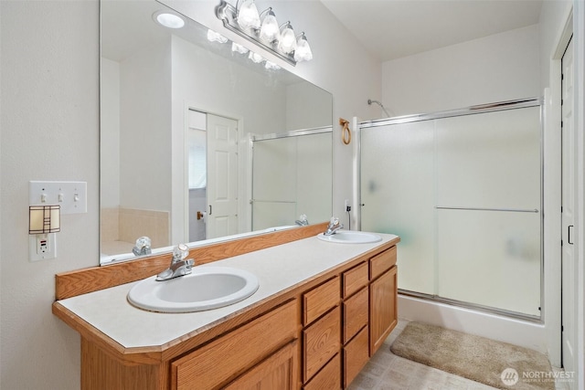 14647 NW Honeyhill Loop, Seabeck, WA 98380 - bathroom with a shower with shower door, double vanity, and tile patterned floors