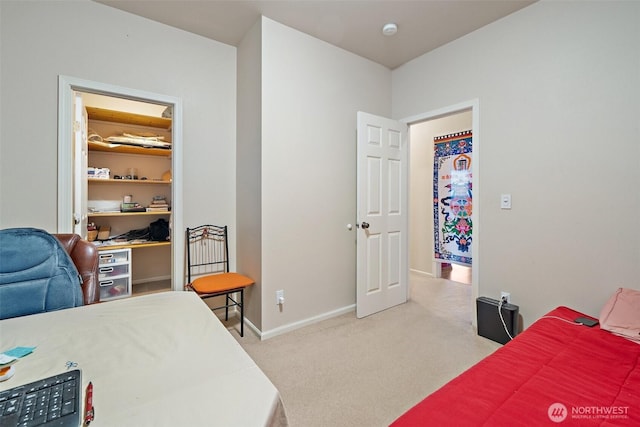 14647 NW Honeyhill Loop, Seabeck, WA 98380 - bedroom with light carpet, baseboards, and a spacious closet