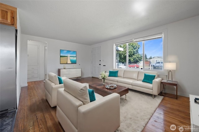 177 E St SE, Ephrata, WA 98823 - living room with wood finished floors and a textured ceiling