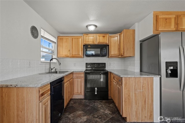 177 E St SE, Ephrata, WA 98823 - kitchen featuring black appliances, a sink, decorative backsplash, light stone countertops, and dark stone finish flooring