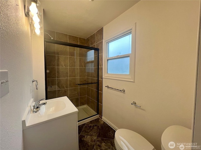 177 E St SE, Ephrata, WA 98823 - full bathroom with toilet, a shower stall, baseboards, and vanity