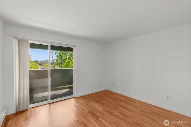 10329 Meridian Ave N Unit A201, Seattle, WA 98133 - spare room featuring wood finished floors and baseboards