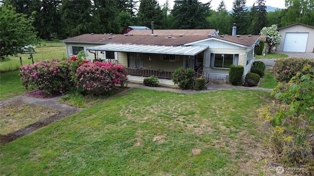 22665 Mosier Rd, Sedro Woolley, WA 98284 - view of front of house featuring a porch, a front lawn, driveway, and a detached garage