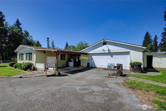 22665 Mosier Rd, Sedro Woolley, WA 98284 - ranch-style house with asphalt driveway and an attached garage