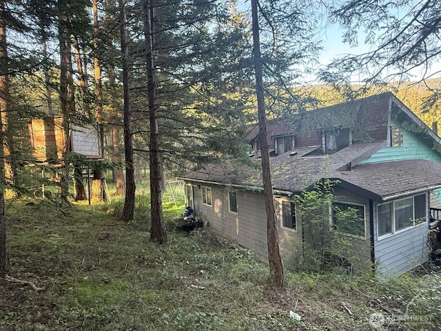 39 Otters Lair Ln, Orcas Island, WA 98245 - view of property exterior featuring roof with shingles