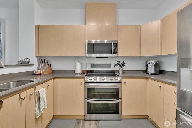 14525 1st Ln NE Unit C, Duvall, WA 98019 - kitchen with appliances with stainless steel finishes, light brown cabinetry, and a sink