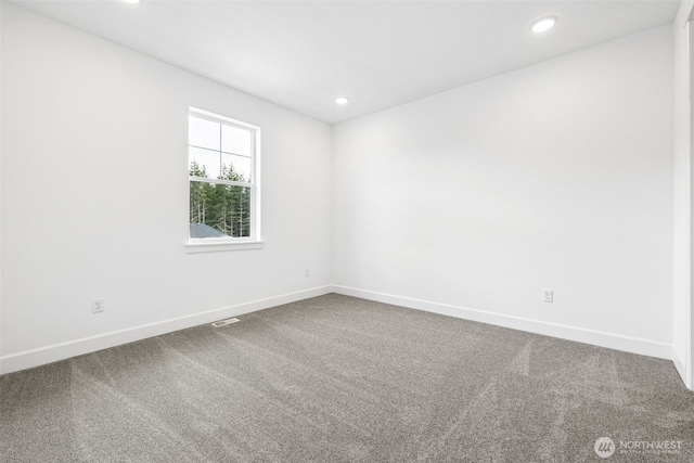 15612 210th Ave E Unit 313, Bonney Lake, WA 98391 - spare room featuring dark carpet, baseboards, and recessed lighting