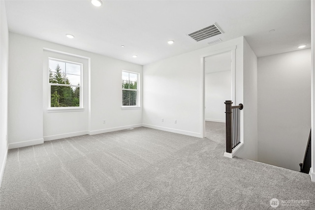 15612 210th Ave E Unit 313, Bonney Lake, WA 98391 - spare room with carpet, recessed lighting, and baseboards