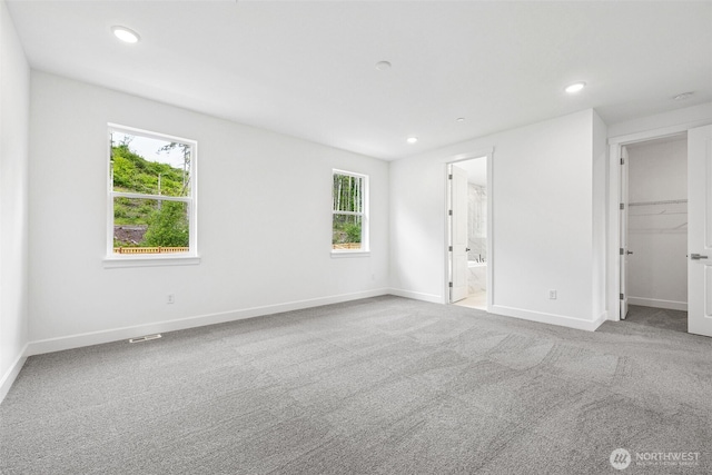 15612 210th Ave E Unit 313, Bonney Lake, WA 98391 - unfurnished bedroom featuring recessed lighting, baseboards, carpet floors, a spacious closet, and connected bathroom