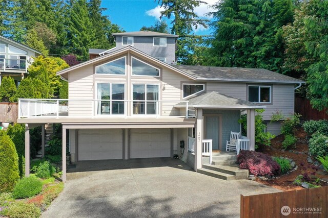1402 E Lake Dr, Bremerton, WA 98312 - view of front facade with a garage, concrete driveway, and a shingled roof