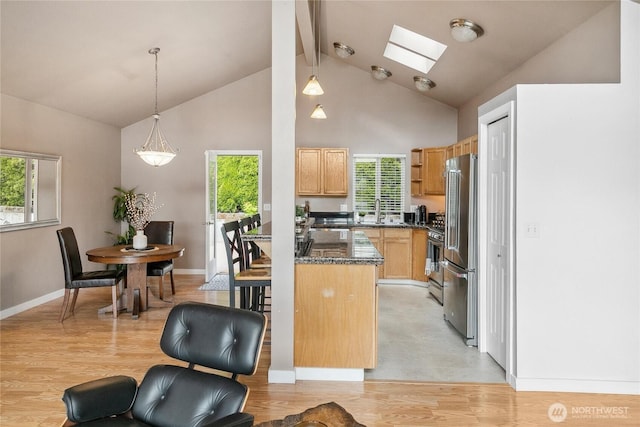 1402 E Lake Dr, Bremerton, WA 98312 - kitchen featuring appliances with stainless steel finishes, a skylight, healthy amount of natural light, beamed ceiling, and high vaulted ceiling