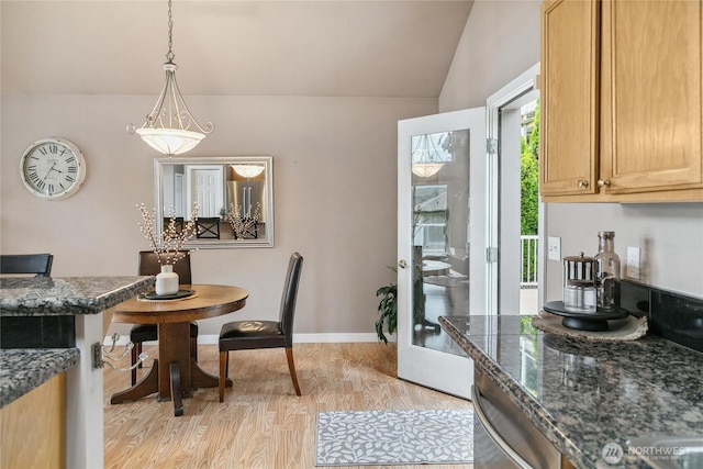 1402 E Lake Dr, Bremerton, WA 98312 - dining space featuring vaulted ceiling, light wood-style flooring, and baseboards
