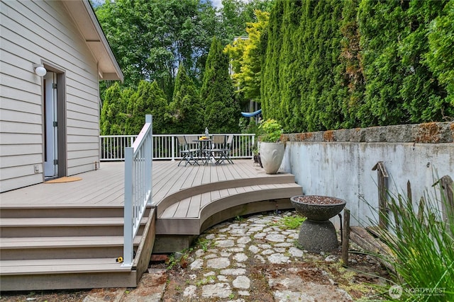 1402 E Lake Dr, Bremerton, WA 98312 - wooden terrace featuring outdoor dining area and view of scattered trees