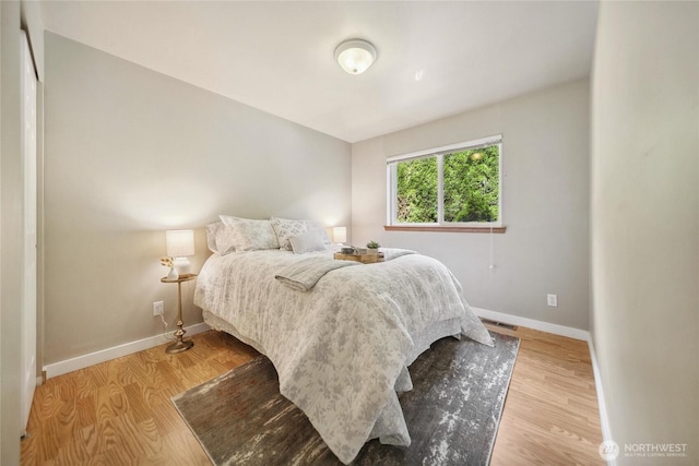 1402 E Lake Dr, Bremerton, WA 98312 - bedroom featuring baseboards and light wood finished floors