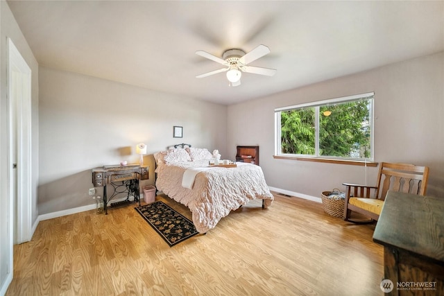 1402 E Lake Dr, Bremerton, WA 98312 - bedroom featuring baseboards, wood finished floors, and a ceiling fan