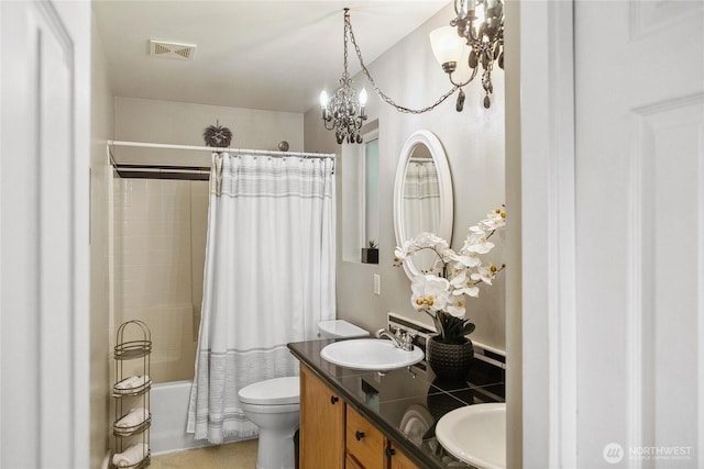 1402 E Lake Dr, Bremerton, WA 98312 - bathroom with a chandelier, double vanity, toilet, shower / tub combo with curtain, and tile patterned flooring