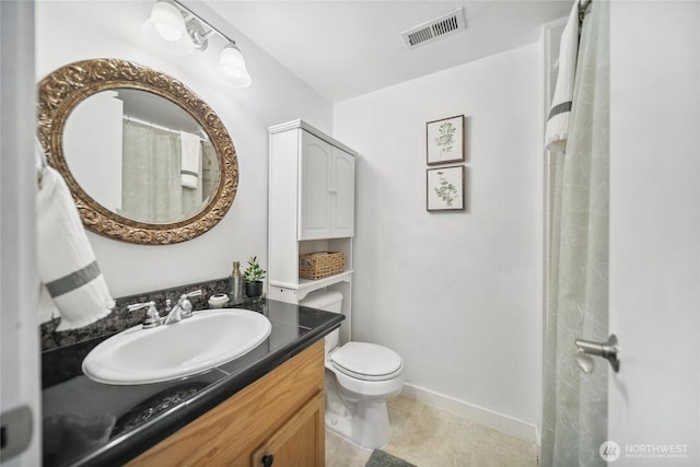 1402 E Lake Dr, Bremerton, WA 98312 - bathroom with vanity, toilet, and baseboards