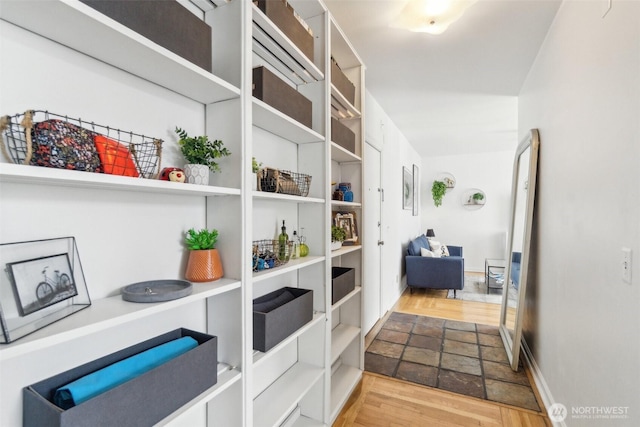 22 John St Unit 10, Seattle, WA 98109 - corridor featuring wood finished floors and baseboards