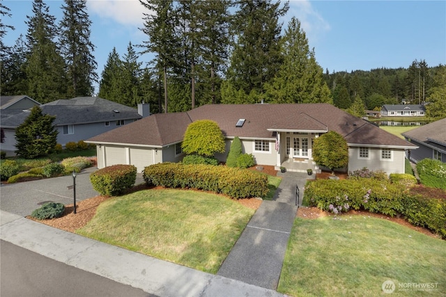 211 Greenview Ln, Port Ludlow, WA 98365 - view of front facade with a front yard, french doors, a garage, and driveway