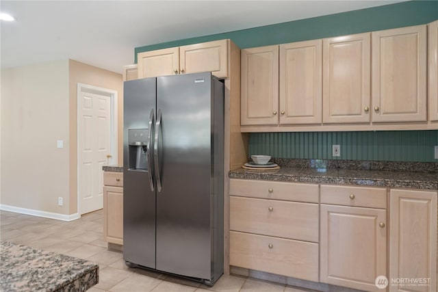 211 Greenview Ln, Port Ludlow, WA 98365 - kitchen featuring stainless steel fridge with ice dispenser, light brown cabinets, light tile patterned floors, and baseboards