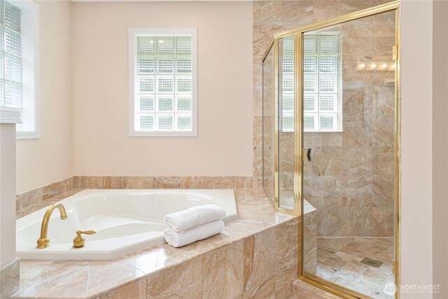 211 Greenview Ln, Port Ludlow, WA 98365 - bathroom with healthy amount of natural light, a bath, and a stall shower