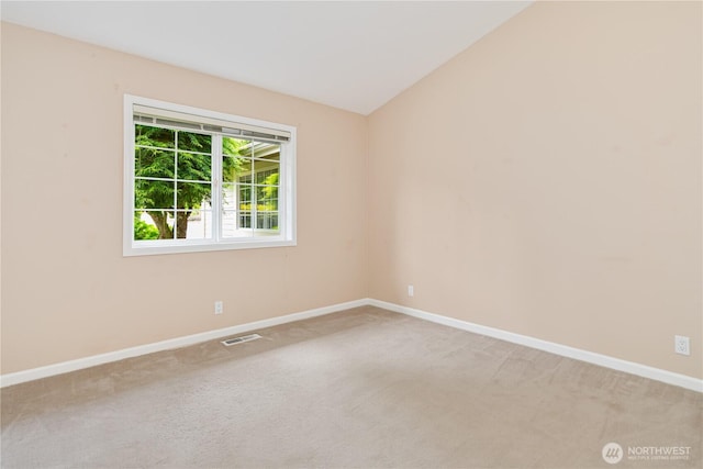 211 Greenview Ln, Port Ludlow, WA 98365 - carpeted spare room featuring baseboards and vaulted ceiling