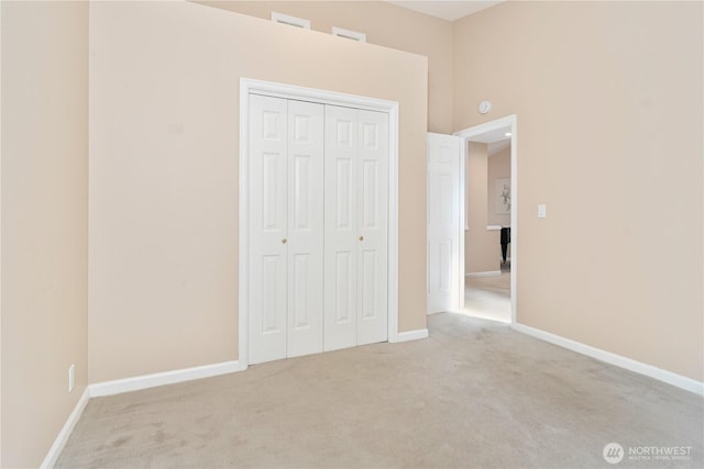 211 Greenview Ln, Port Ludlow, WA 98365 - unfurnished bedroom with light colored carpet, a closet, and baseboards
