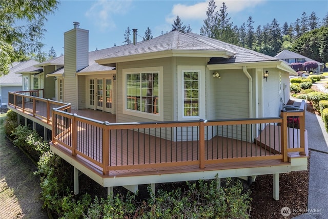 211 Greenview Ln, Port Ludlow, WA 98365 - rear view of house with a deck, french doors, a shingled roof, and a chimney