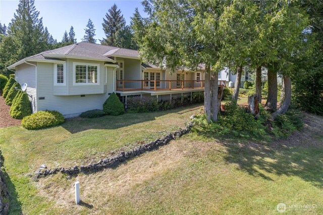 211 Greenview Ln, Port Ludlow, WA 98365 - view of front of house with a front yard and a wooden deck