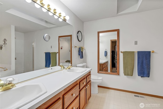 4716 266th St E, Spanaway, WA 98387 - full bathroom with toilet, double vanity, a stall shower, and baseboards