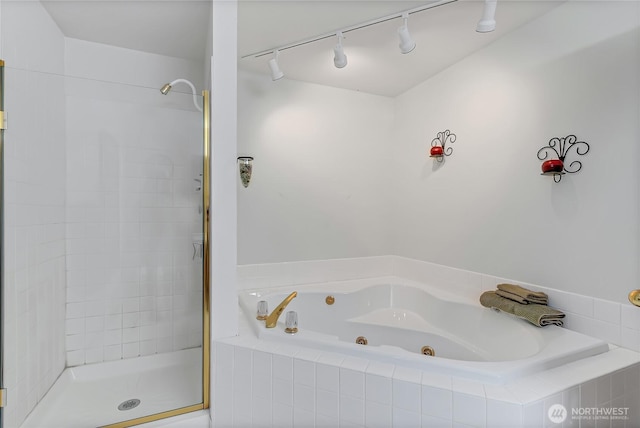 4716 266th St E, Spanaway, WA 98387 - bathroom featuring a tub with jets, a shower stall, and rail lighting
