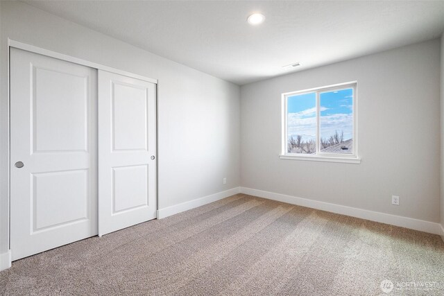 4223 W Sandy Ct, Moses Lake, WA 98837 - unfurnished bedroom featuring carpet floors, baseboards, a closet, and recessed lighting