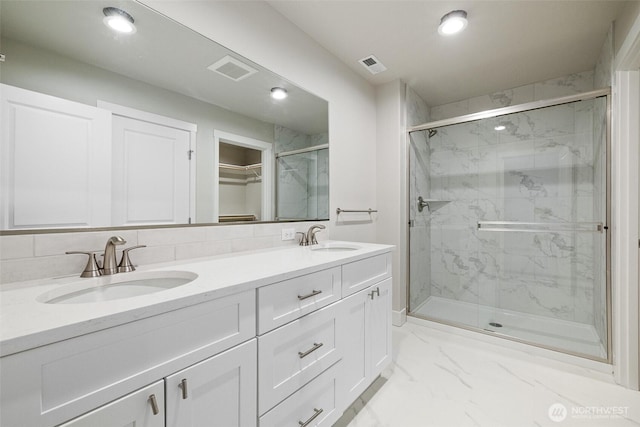 4223 W Sandy Ct, Moses Lake, WA 98837 - full bath with a marble finish shower, double vanity, recessed lighting, and marble finish floors