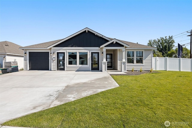 4208 W Sandy Ct, Moses Lake, WA 98837 - view of front of house featuring a garage, concrete driveway, and board and batten siding
