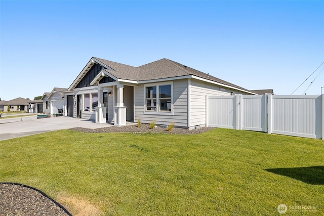 4208 W Sandy Ct, Moses Lake, WA 98837 - view of front of home with driveway, a garage, and roof with shingles