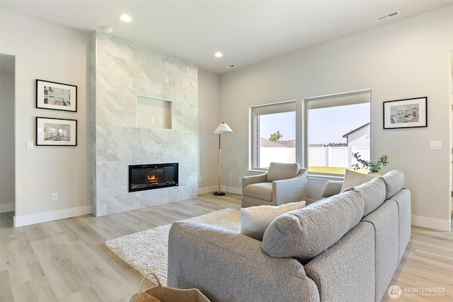 4208 W Sandy Ct, Moses Lake, WA 98837 - living area featuring a tile fireplace, light wood finished floors, and recessed lighting